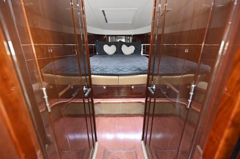 Slide: The Image of Luxurious cabin interior of 2009 Sea Ray 470 Sundancer yacht with plush bedding. - 46