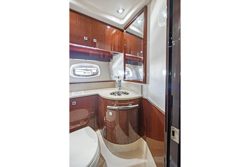 Slide: The Image of Luxurious bathroom interior of 2009 Sea Ray 470 Sundancer yacht with wood cabinetry. - 48
