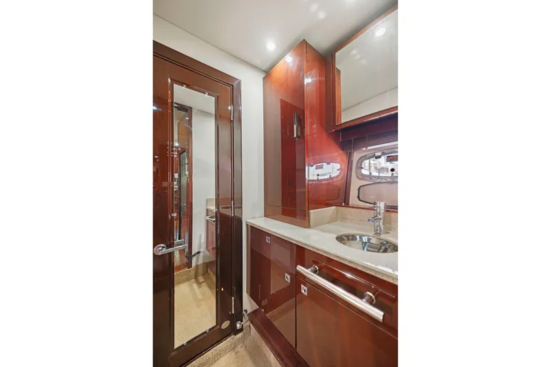 Slide: The Image of Luxurious bathroom interior of 2009 Sea Ray 470 Sundancer yacht with wood finish and modern fixtures. - 51