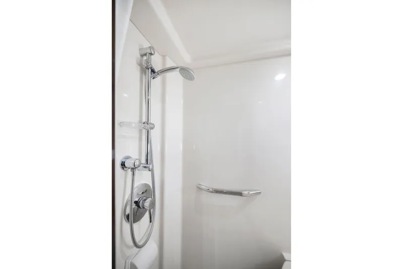 Slide: The Image of Shower area in 2009 Sea Ray 470 Sundancer yacht, featuring modern chrome fixtures. - 52
