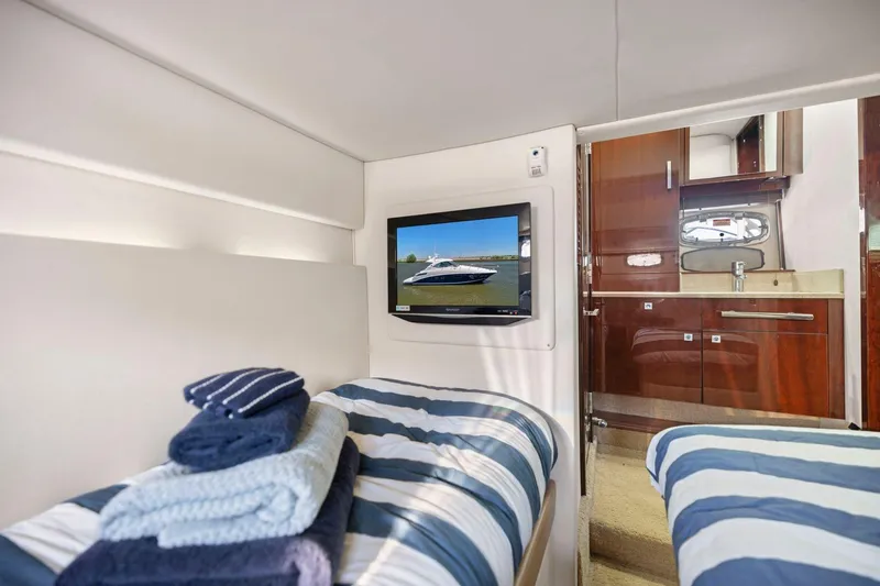 Slide: The Image of Interior of 2009 Sea Ray 470 Sundancer yacht with twin beds and TV. - 55