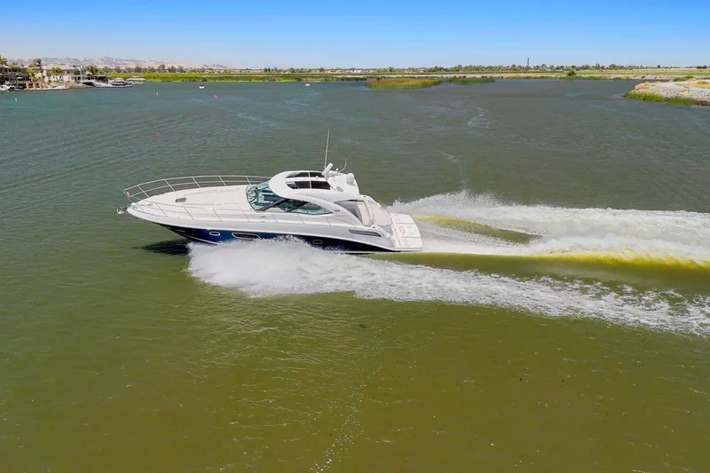 Slide: The Image of 2009 Sea Ray 470 Sundancer yacht cruising on a sunny day in open waters. - 6