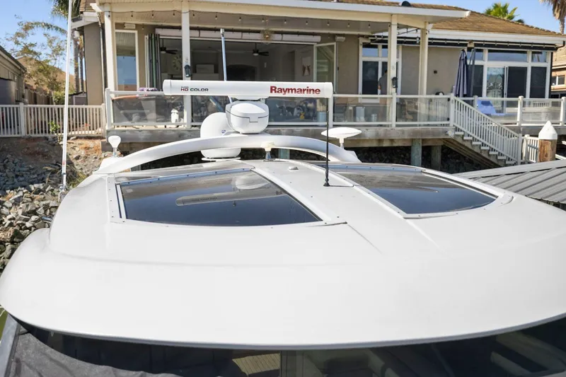 Slide: The Image of 2009 Sea Ray 470 Sundancer yacht docked near waterfront home. - 61