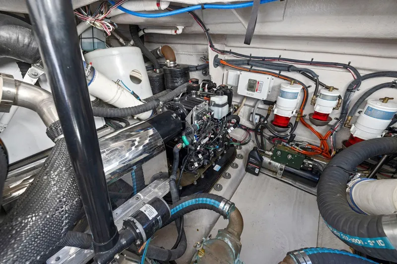Slide: The Image of Engine room of 2009 Sea Ray 470 Sundancer with visible components and wiring. - 65