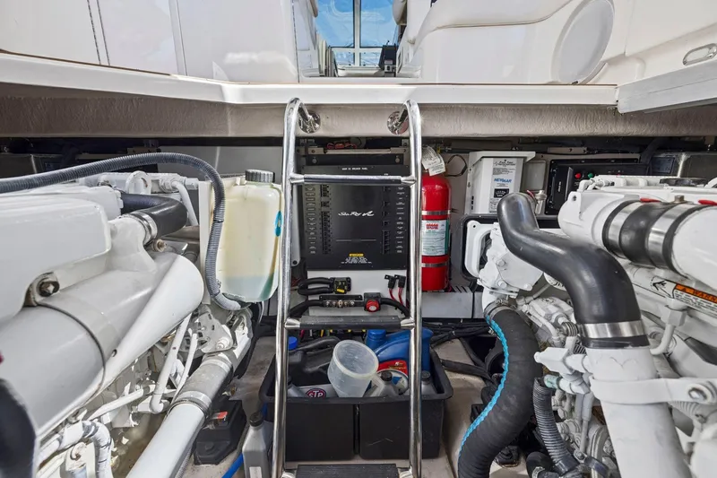 Slide: The Image of Engine room of 2009 Sea Ray 470 Sundancer with visible machinery and equipment. - 68