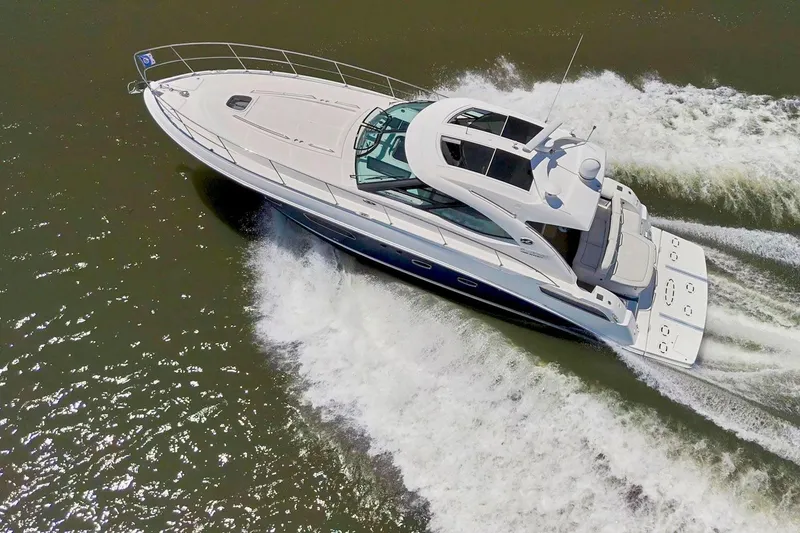 Slide: The Image of 2009 Sea Ray 470 Sundancer yacht cruising on open water, aerial view. - 9