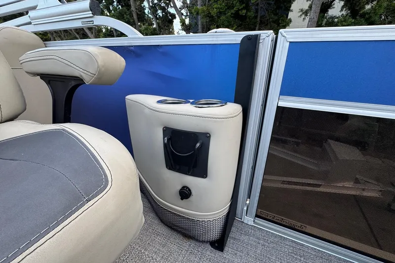 Slide: The Image of 2023 Barletta ARIA 22QC boat interior with cup holders and seating. - 39