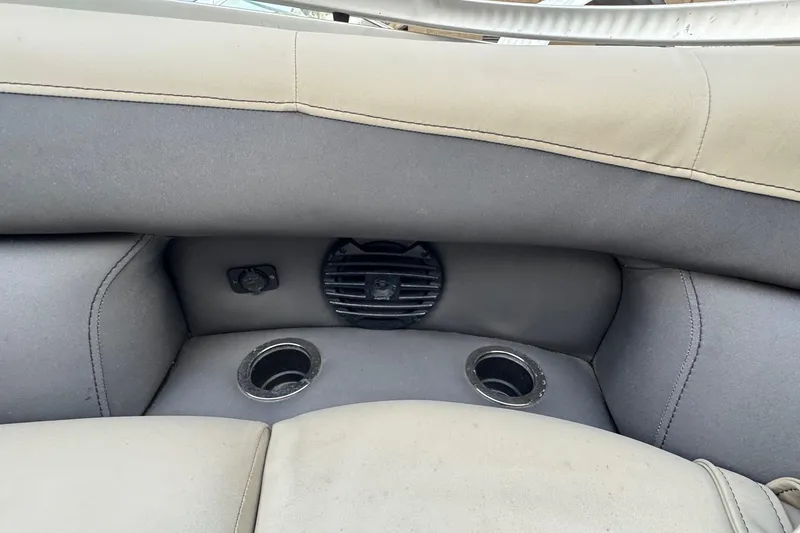 Slide: The Image of 2023 Barletta ARIA 22QC boat interior with cup holders and speaker. - 67