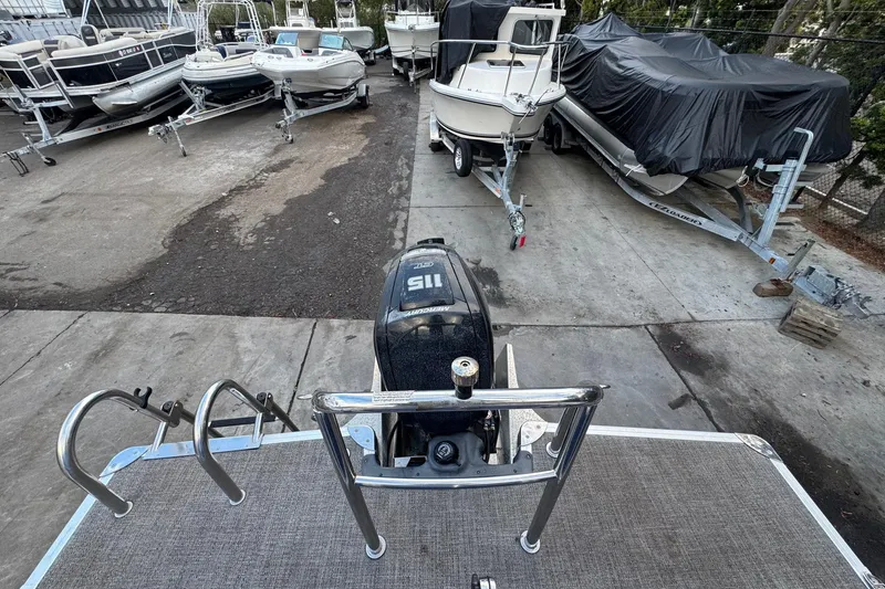 Slide: The Image of 2023 Barletta ARIA 22QC pontoon boat in storage yard with other boats. - 69