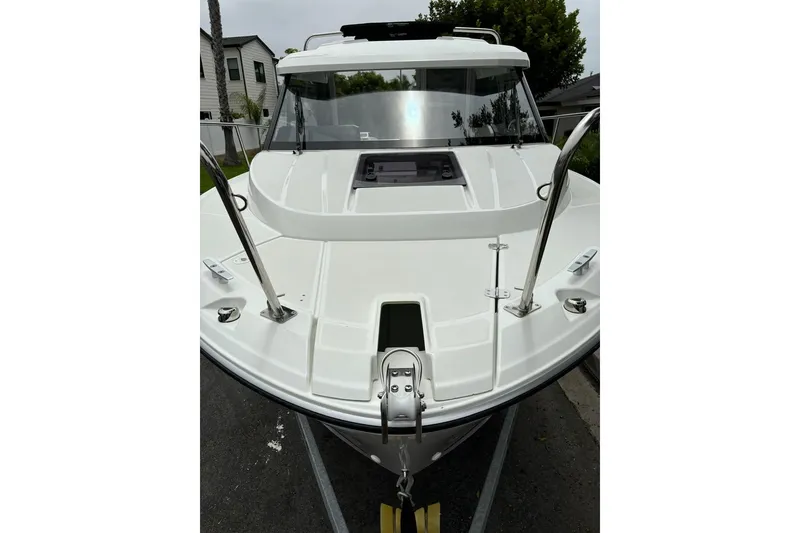 Slide: The Image of 2023 Jeanneau NC Weekender 695 Series 2 boat, front view, on trailer. - 33