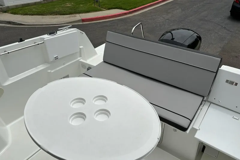 Slide: The Image of 2023 Jeanneau NC Weekender 695 Series 2 boat interior with seating and table. - 8