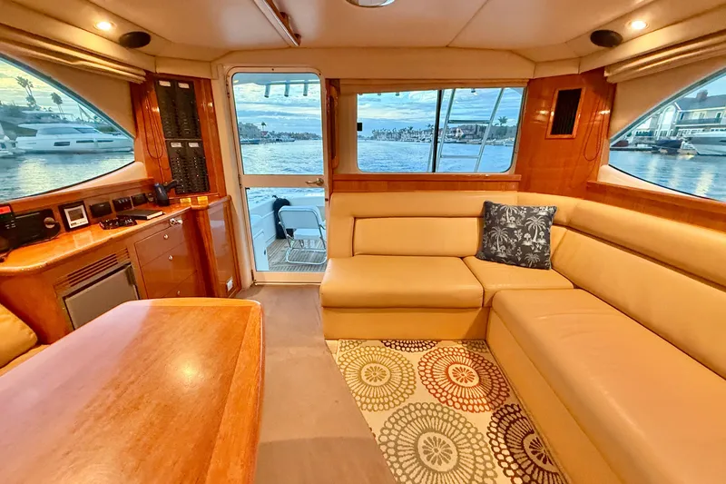 Slide: The Image of Luxurious interior of 2001 Riviera 40 Flybridge yacht with scenic water view. - 18