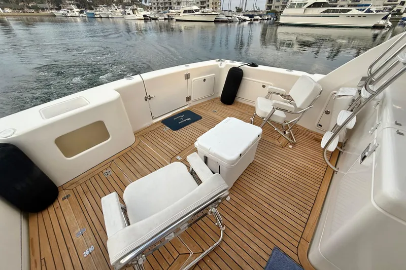 Slide: The Image of 2001 Riviera 40 Flybridge yacht deck with chairs and ocean view. - 36
