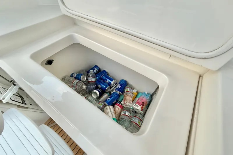 Slide: The Image of Beverage storage on 2001 Riviera 40 Flybridge, filled with cans and bottles. - 40