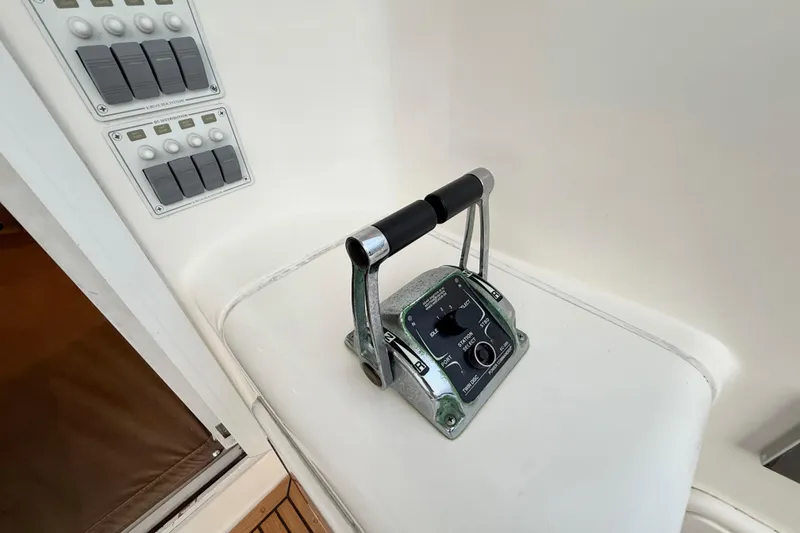 Slide: The Image of Control panel and throttle of 2001 Riviera 40 Flybridge yacht. - 41