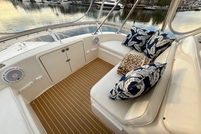 Slide: The Image of Luxurious 2001 Riviera 40 Flybridge yacht interior with plush seating and decorative pillows. - 49