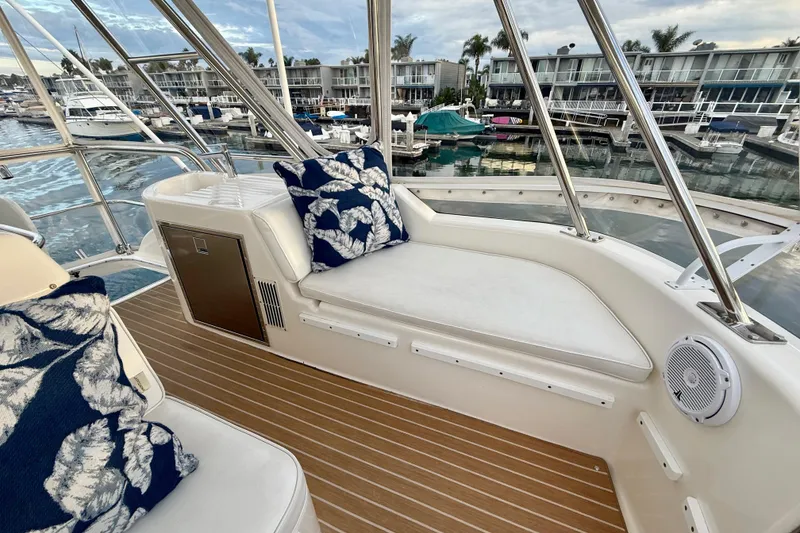 Slide: The Image of Luxurious 2001 Riviera 40 Flybridge yacht interior with plush seating and marina view. - 50