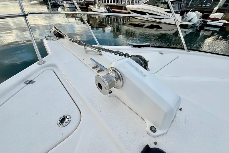 Slide: The Image of 2001 Riviera 40 Flybridge yacht deck with anchor chain and winch system. - 56