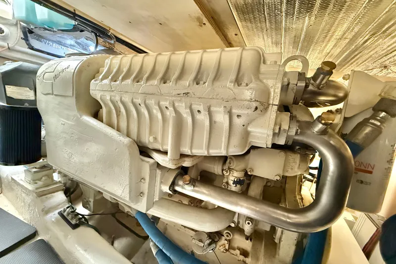 Slide: The Image of Engine compartment of a 2001 Riviera 40 Flybridge yacht, showcasing mechanical components. - 67