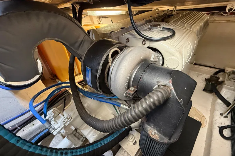 Slide: The Image of Engine compartment of a 2001 Riviera 40 Flybridge boat, showcasing mechanical components. - 71