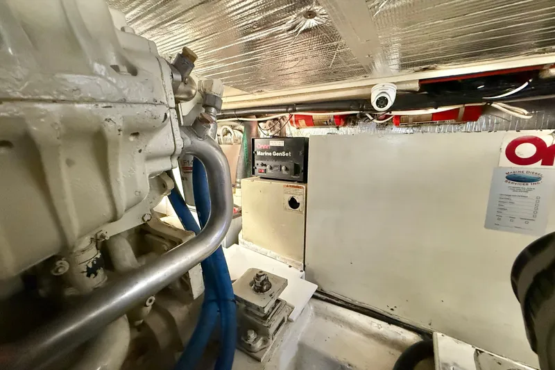 Slide: The Image of Engine room of 2001 Riviera 40 Flybridge with Onan generator and marine equipment. - 73
