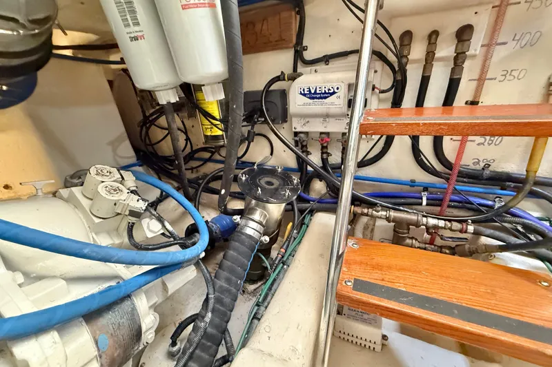 Slide: The Image of Engine room of 2001 Riviera 40 Flybridge with visible wiring and components. - 74