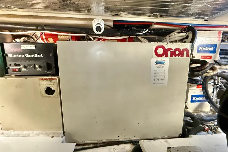 Slide: The Image of Engine room of 2001 Riviera 40 Flybridge with Onan Marine GenSet. - 76