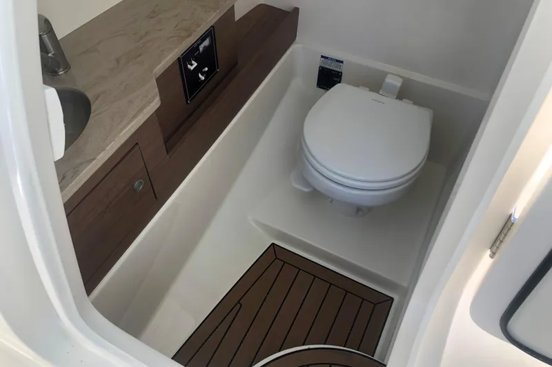 Slide: The Image of 2024 Boston Whaler 280 Vantage boat interior with modern bathroom amenities. - 9