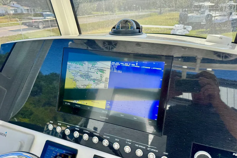 Slide: The Image of Garmin navigation display on 2021 Regulator 26XO boat dashboard. - 13