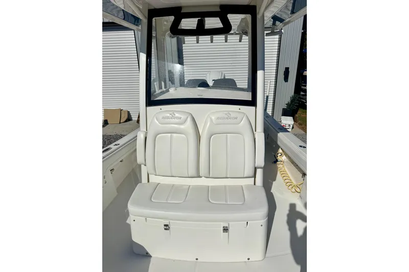 Slide: The Image of 2021 Regulator 26XO boat interior with white seating and console. - 17