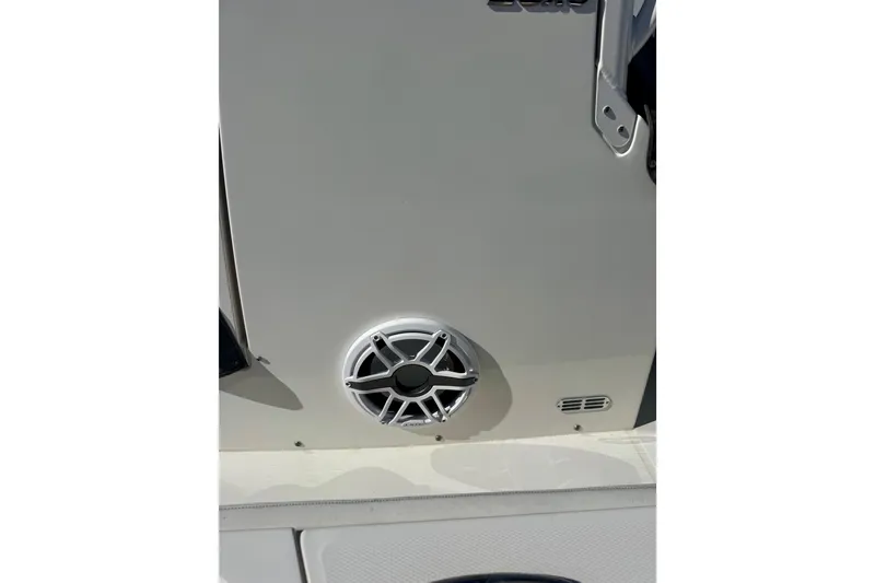 Slide: The Image of 2021 Regulator 26XO boat speaker detail with sleek design. - 22