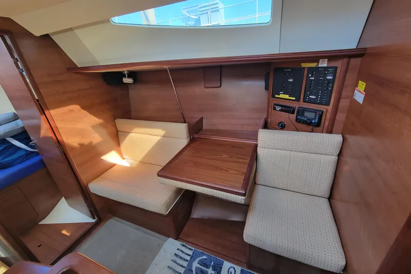 Slide: The Image of Interior of 2013 Hunter 33 sailboat with seating and control panel. - 6