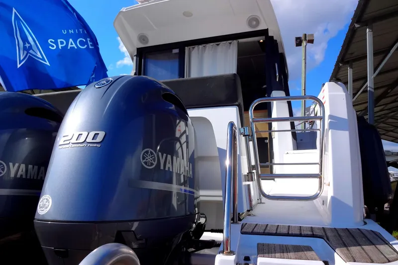 Slide: The Image of 2022 Jeanneau Merry Fisher 895 Offshore with Yamaha engines and United Space flag. - 10