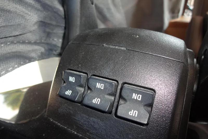 Slide: The Image of Control panel with "UP" and "DN" buttons on Jeanneau Merry Fisher 895 Offshore, 2022 model. - 101