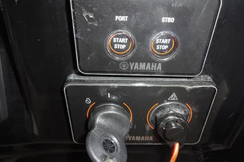 Slide: The Image of Control panel of 2022 Jeanneau Merry Fisher 895 Offshore with Yamaha start-stop buttons. - 102