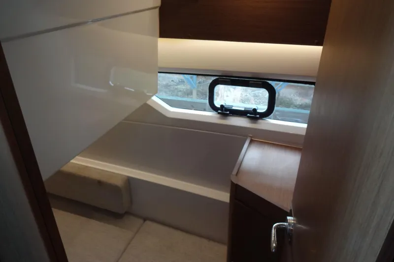 Slide: The Image of Interior of 2022 Jeanneau Merry Fisher 895 Offshore boat, featuring a compact bathroom. - 114