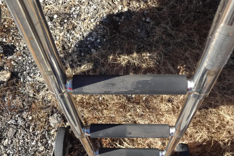 Slide: The Image of Stainless steel boat ladder on dry grass, Jeanneau Merry Fisher 895 Offshore, 2022. - 12