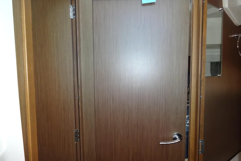 Slide: The Image of Wooden interior door on 2022 Jeanneau Merry Fisher 895 Offshore boat. - 121