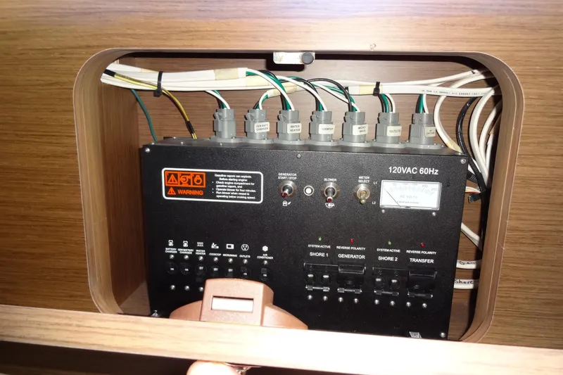 Slide: The Image of Electrical panel of 2022 Jeanneau Merry Fisher 895 Offshore boat, showcasing wiring and controls. - 147