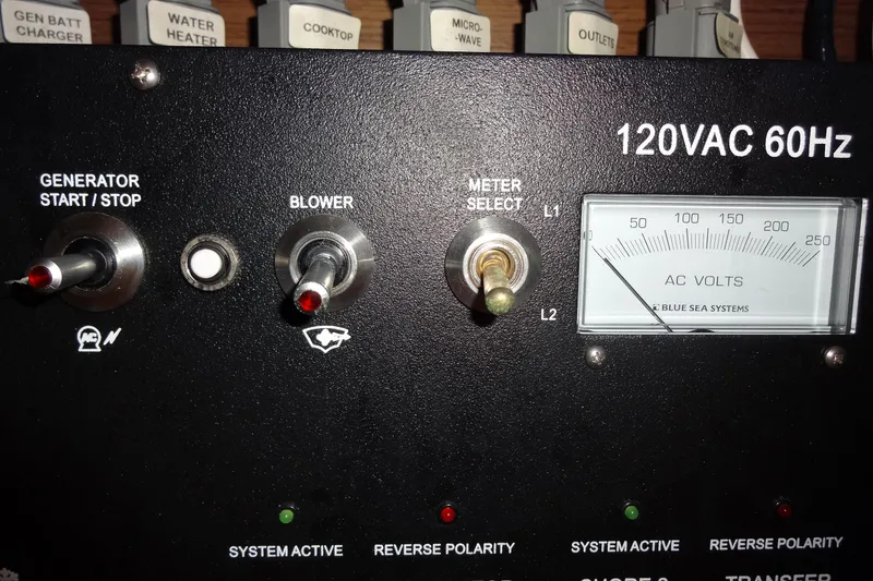 Slide: The Image of Control panel of a 2022 Jeanneau Merry Fisher 895 Offshore boat, showing AC voltage meter. - 151