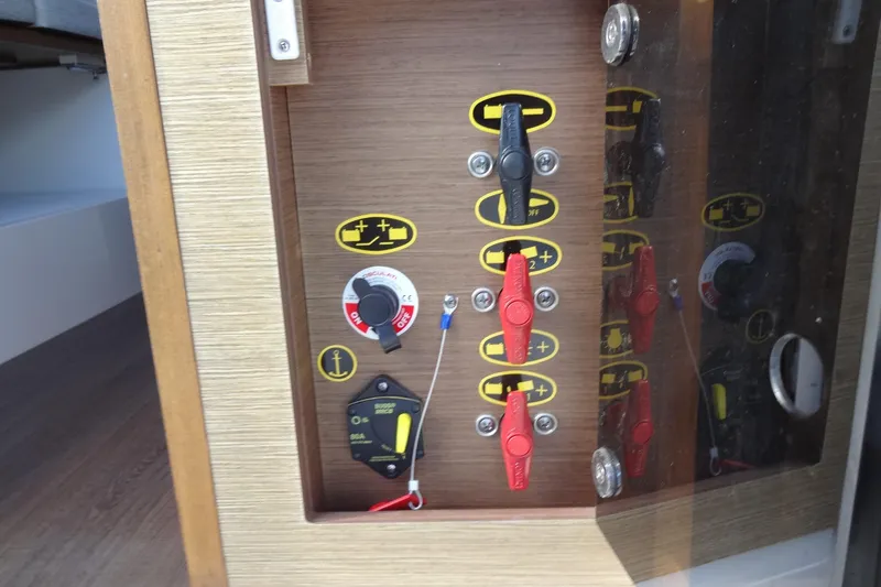 Slide: The Image of Control panel on 2022 Jeanneau Merry Fisher 895 Offshore boat, featuring switches and dials. - 155