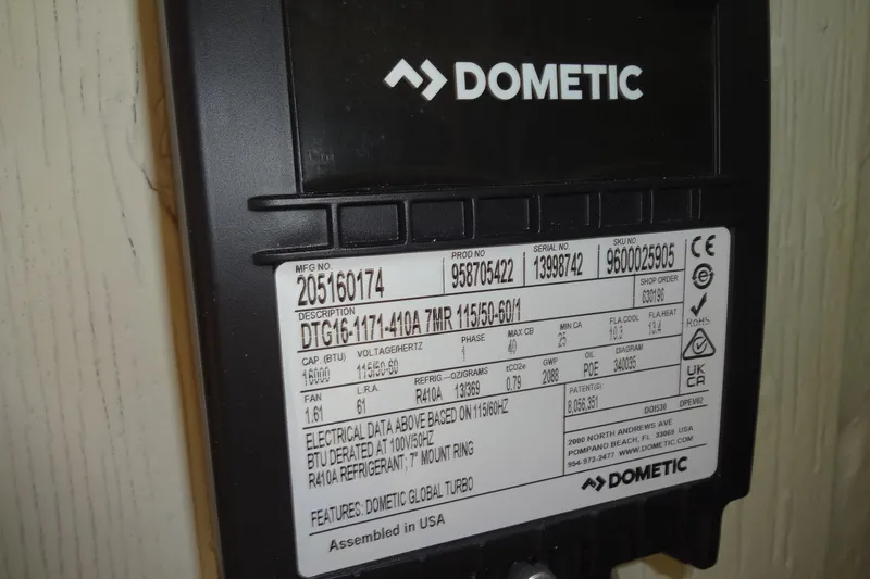 Slide: The Image of Dometic device label with specifications, including model DTG16-4171-410A, R410A refrigerant, and electrical data. - 156