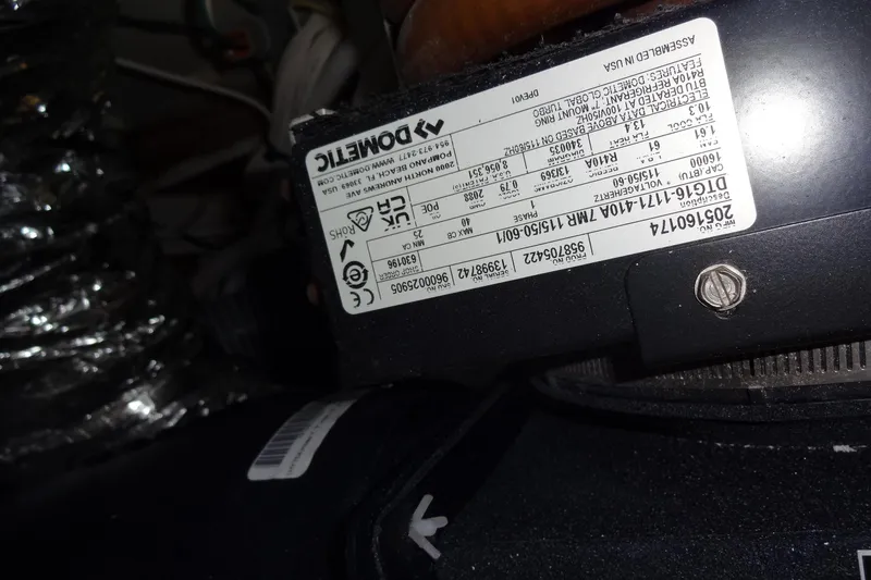 Slide: The Image of Close-up of a Dometic component label inside a 2022 Jeanneau Merry Fisher 895 Offshore. - 158