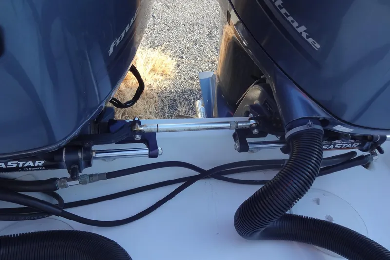 Slide: The Image of Twin outboard engines on a 2022 Jeanneau Merry Fisher 895 Offshore boat. - 164