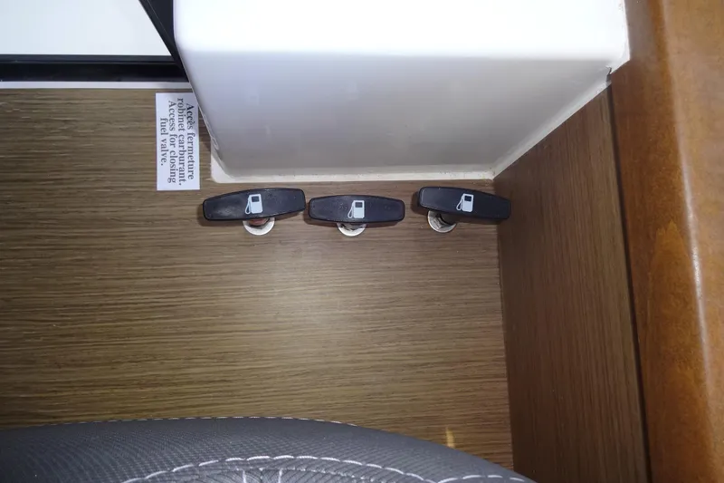 Slide: The Image of Fuel valve controls on 2022 Jeanneau Merry Fisher 895 Offshore boat interior. - 166