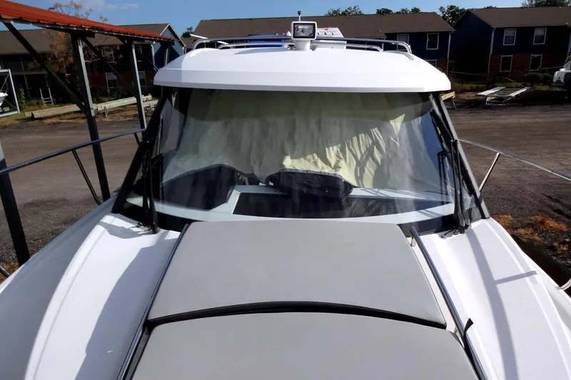 Slide: The Image of 2022 Jeanneau Merry Fisher 895 Offshore boat, front view with windshield and deck. - 17