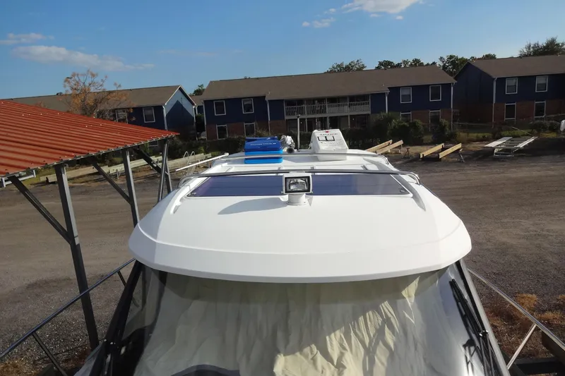 Slide: The Image of 2022 Jeanneau Merry Fisher 895 Offshore boat docked near residential area. - 19