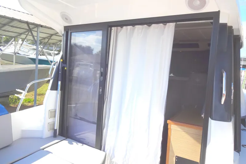 Slide: The Image of Sliding door and curtain on 2022 Jeanneau Merry Fisher 895 Offshore boat. - 34