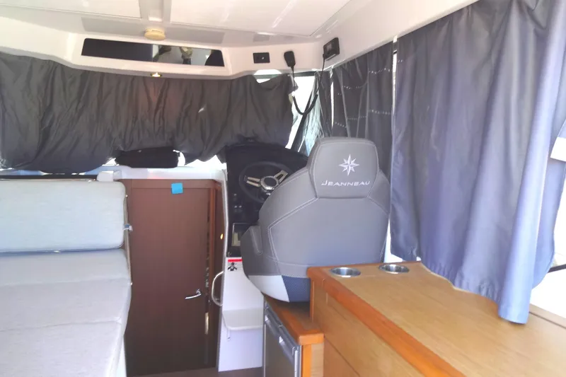 Slide: The Image of Interior of 2022 Jeanneau Merry Fisher 895 Offshore boat with helm and seating area. - 36