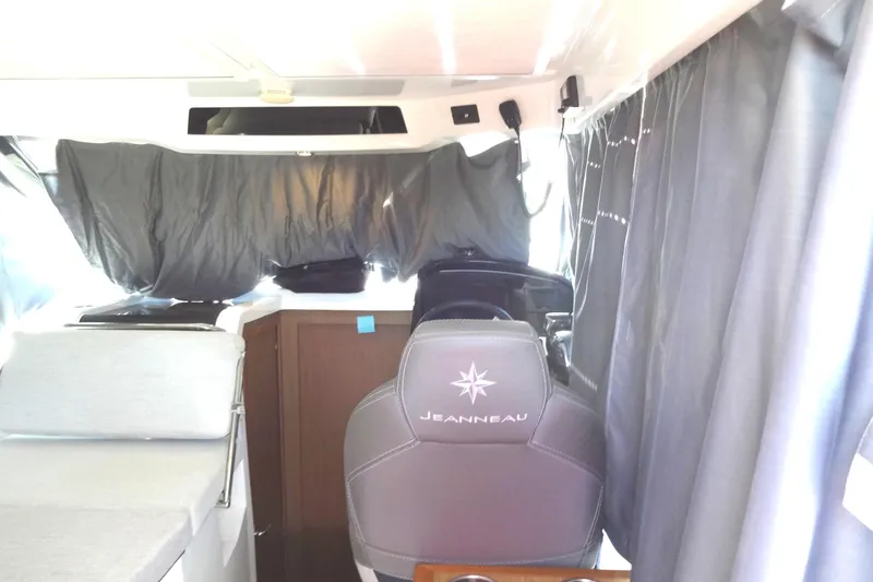 Slide: The Image of Interior of 2022 Jeanneau Merry Fisher 895 Offshore boat with helm and seating area. - 37